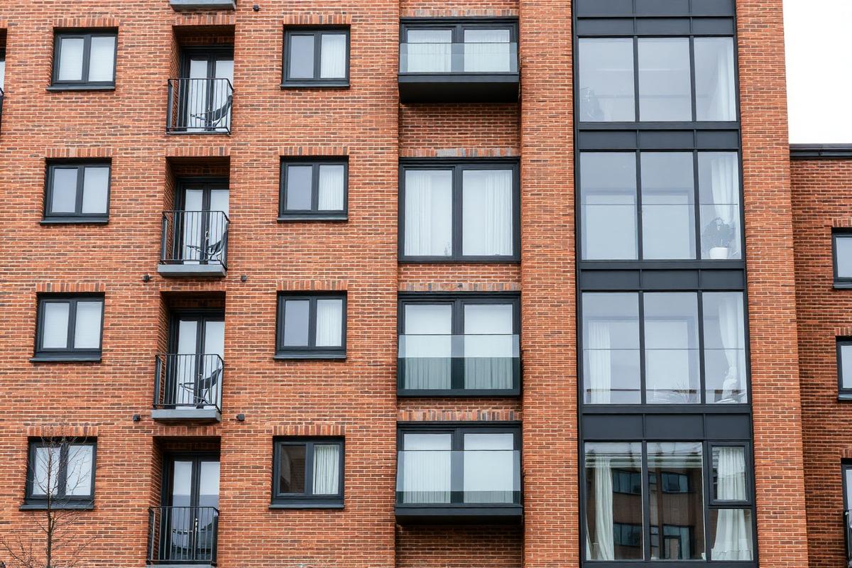 Placeholder imagery — town centre apartment building facade